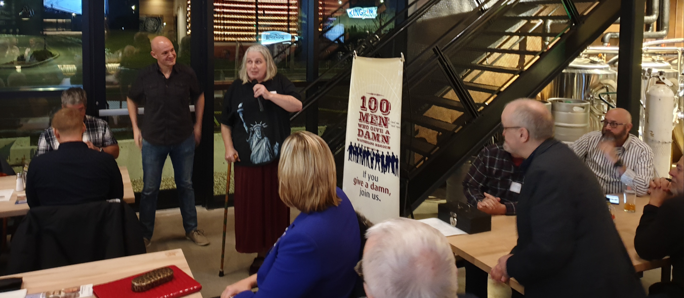 Cait Glasson, President & Communications Liaison Coordinator, speaking at 100 Men Who Give a Damn