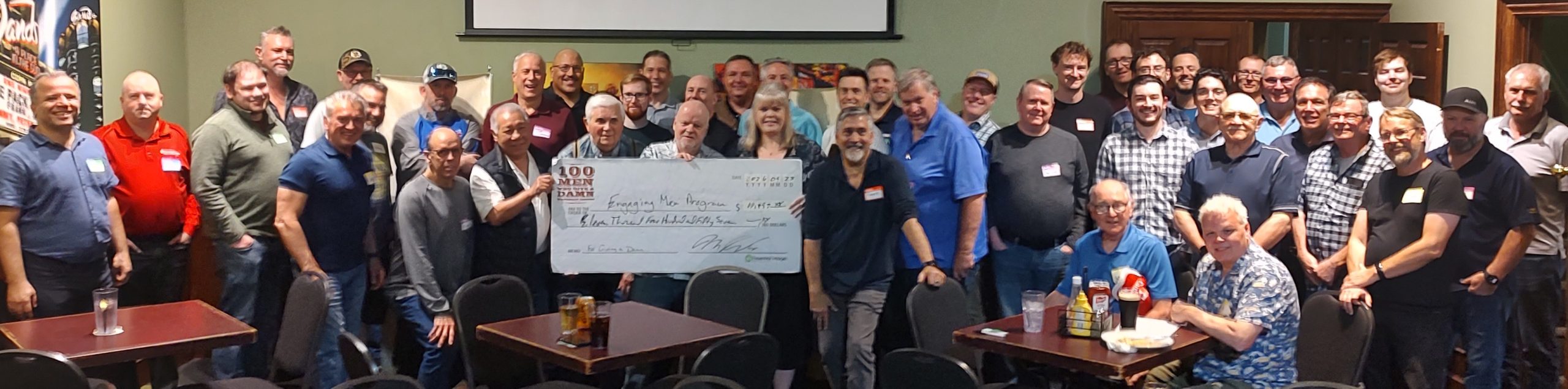 100 Men Who Give a Damn present their Big Cheque to Women's Crisis Services' Engaging Men Program